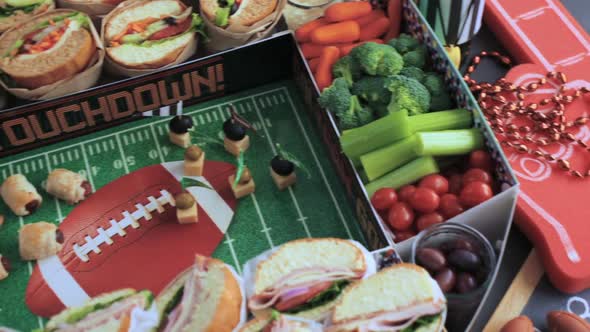 Football Snack Stadium filled with sub sandwiches, veggies and chips.