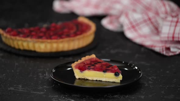 Piece of Berry Tart with Custard and Jelly.