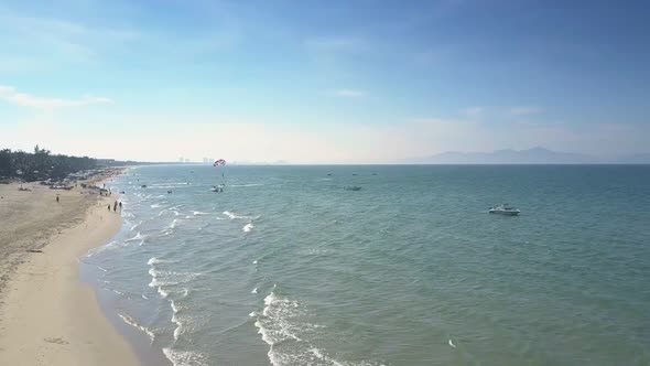 Aerial View People Relax on Sandy Beach Near Blue Ocean