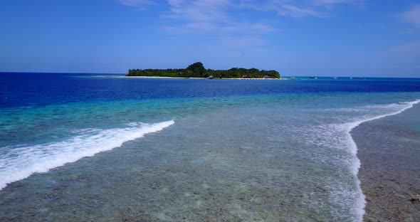 Luxury above travel shot of a sunshine white sandy paradise beach and blue ocean background