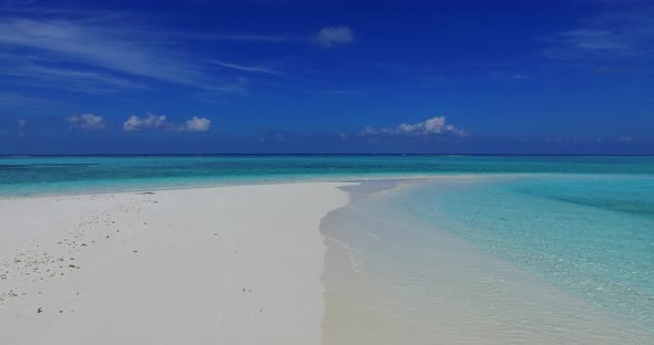 Luxury drone copy space shot of a white sandy paradise beach and aqua blue water background in high 