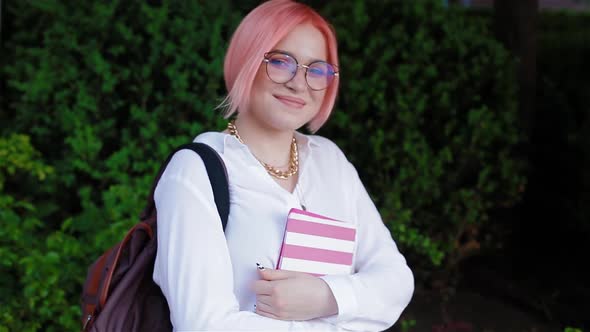 Portrait of a Female Student with Pink Hair