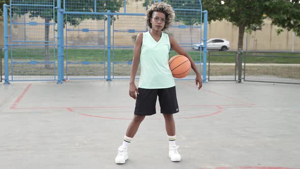 Positive African American Basketball Player Woman Smiling with Thumbs Up Outdoors in the Basket