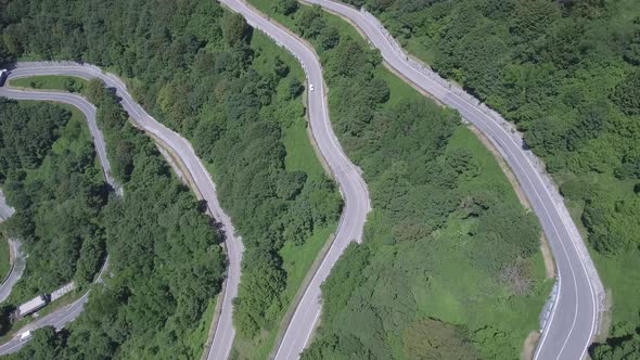 Aerial view of a winding mountain road in Italy