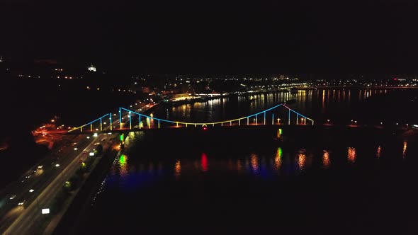 Aerial Drone Footage of Night Kyiv. Walking Bridge at Night