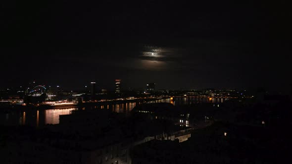 Cologne, Germany - Establishing shot at night of Köln with Moon and the panorama silhouette of the c