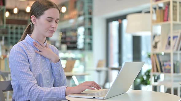 Professional Young Businesswoman Coughing in Cafe