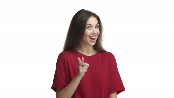 Cheerful Brunette Girl in Red Tshirt Looking Impressed Praising you for Good Point and Smiling