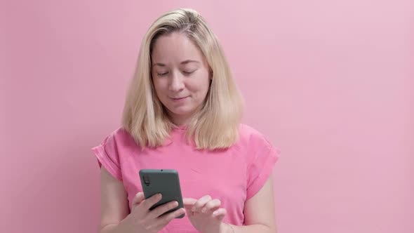 Close Up Portrait of Attractive Young Woman Holds Smartphone