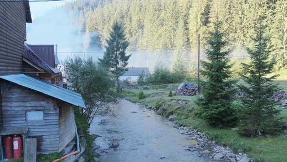 Morning in the Carpathians Wooden Houses By a Mountain Stream Among Pine Trees