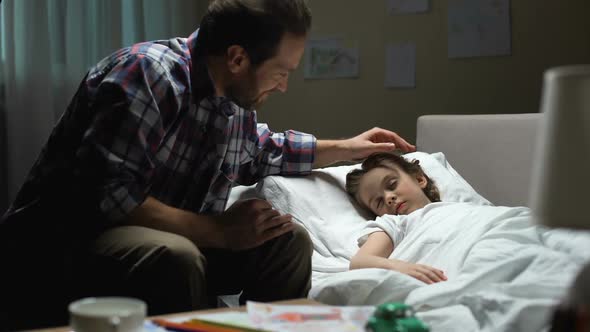 Happy Father Stroking Sleeping Daughter Head Love, Admiring Child, Parenthood