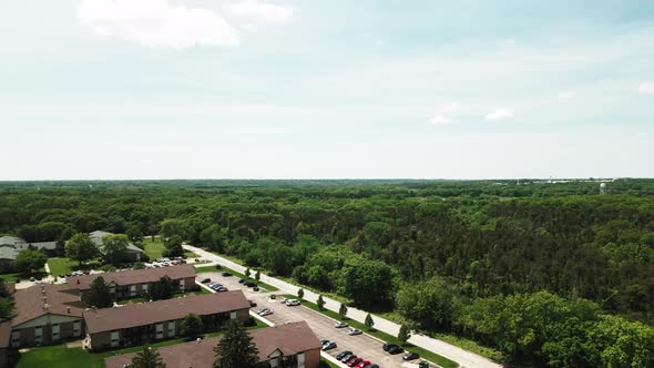 aerial drone footage from park to complex of apartments next to park Argone Park in Willowbrook Ilin