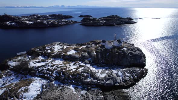 Slow orbit of historic Henningsvaer, on a bright sunny winter day, Norways oldest fishing village, w