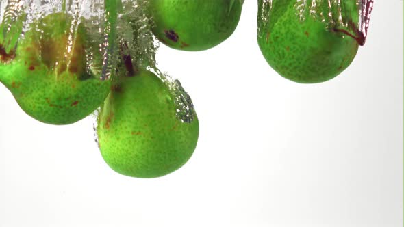 Super Slow Motion Pears Fall Into the Water with Air Bubbles