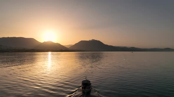 Sunrise Fishing boat goeas to sea aerial view Turkey Alanya 4 K