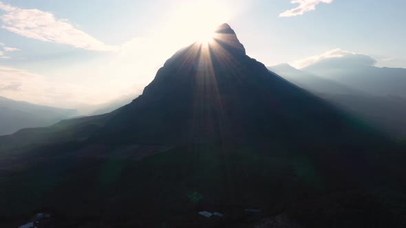 Sun Shining Over Mountain Peak