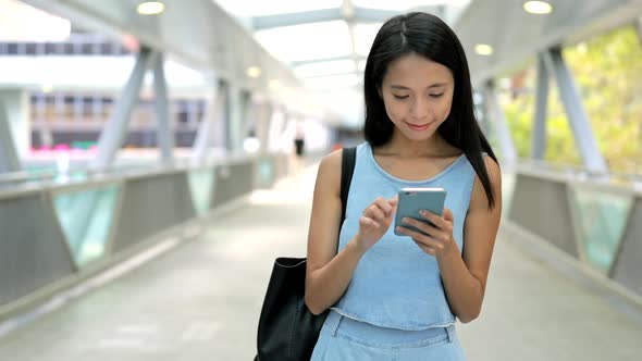 Woman using cellphone at outdoor 