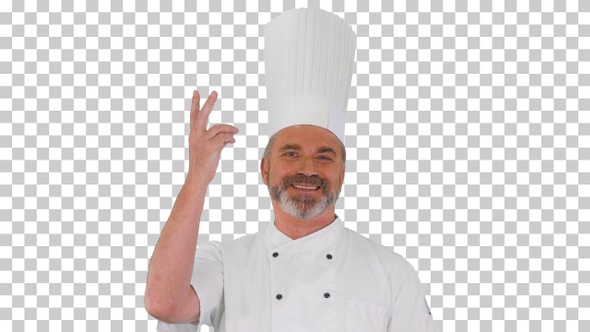 Male chef making real jam gesture to camera, Alpha Channel