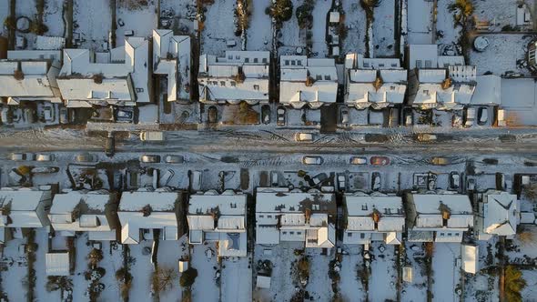 Snowy Streets and Houses in the Early Morning Bird's Eye View