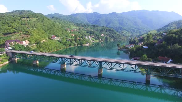 Side view of traffic on bridge over water