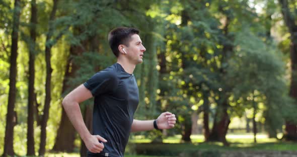 Athlete Jogging In Park Preparing Triathlon Sport Healthy Lifestyle