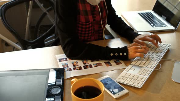 Female graphic designer working on computer