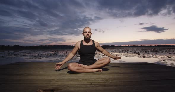 The Athlete Sits in the Lotus Position and Meditates