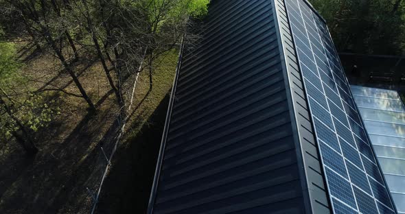 Panning and reviling solar panels on roof.