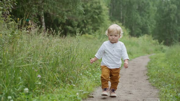 portrait of a child in the park. a child walking alone in the park. alt