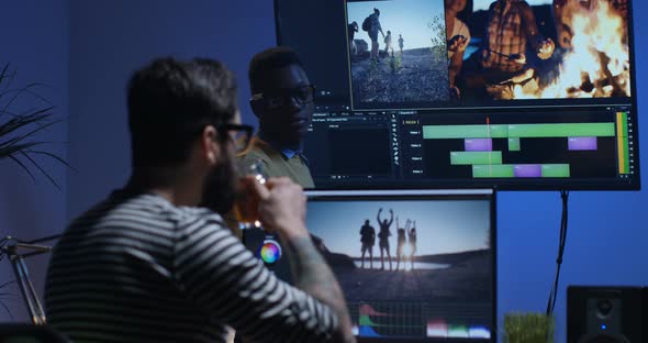 Young Man Editing Video Inside the Room