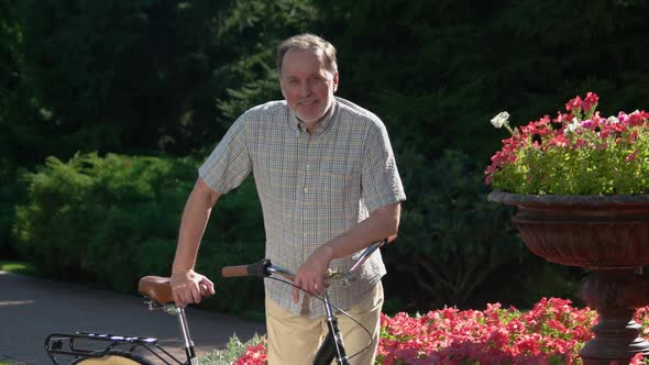 Handsome Mature Man Bicycle Park