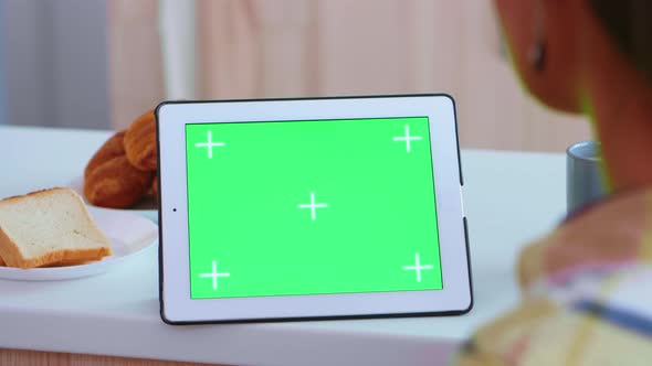 Watching Tablet Computer with Green Screen