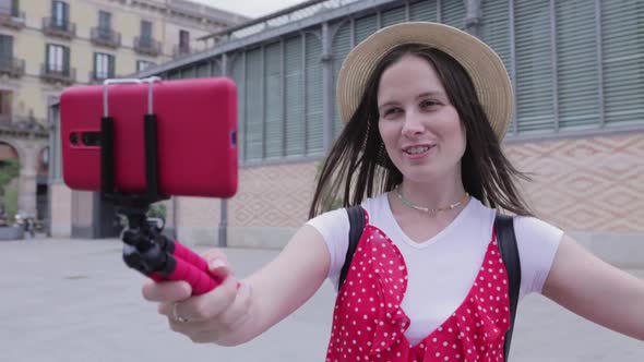 Smiling Young Woman Tourist Recording Content for Her Travel Vlog