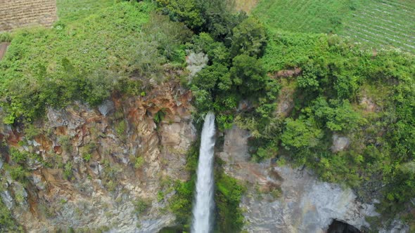 Aerial slow motion: waterfall in Sumatra, travel destination in Berastagi and Lake Toba, Indonesia.