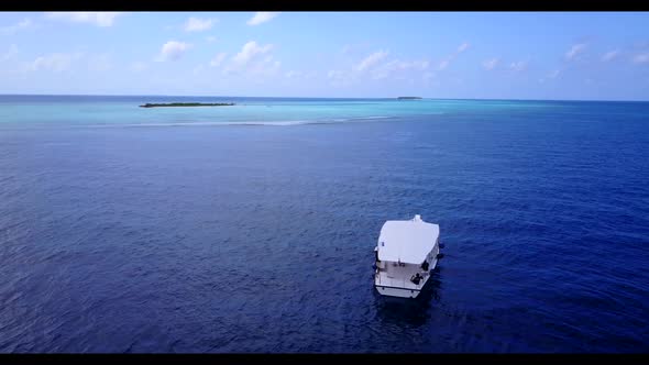 Aerial top down landscape of exotic shore beach holiday by turquoise sea with white sandy background