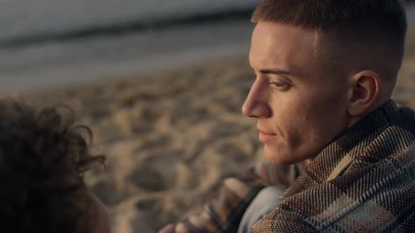 Closeup Young Couple Sitting on Sandy Beach