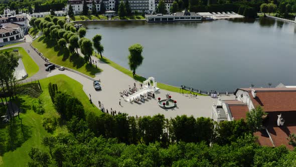 Aerial Drone View Wedding at Lake Promenade with Guests