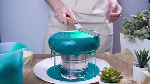 Small Business and Hobby Concept. Woman Decorating Cakes with Mirrored Glaze