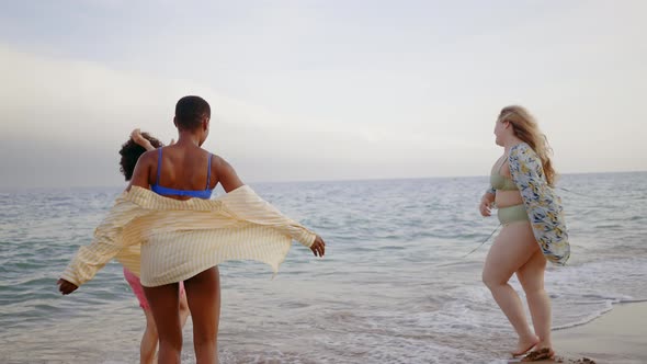 multiethnic young women having fun on the beach