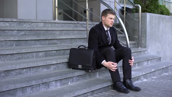 Sad Man in Business Suit Sitting Office Building Stairs, Dismissal Depression