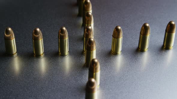 Cinematic rotating shot of bullets on a metallic surface - BULLETS 035