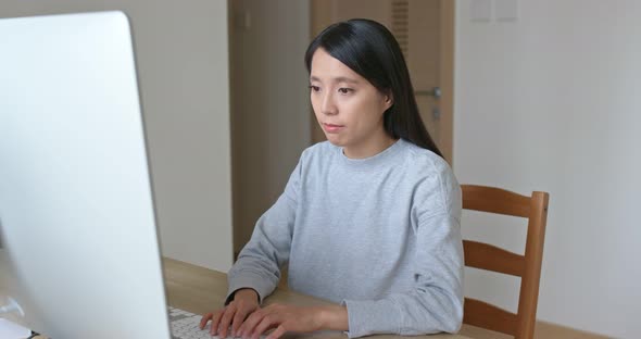 Woman work on computer at home