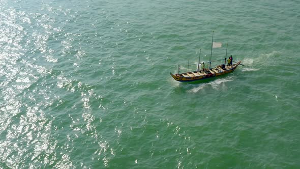 Aerial shot of a boat in a sea during the day