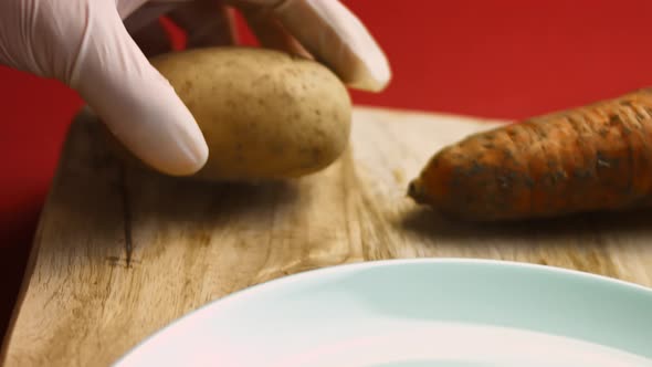 The Cook Peels the Potatoes in Very Pleasant Atmosphere