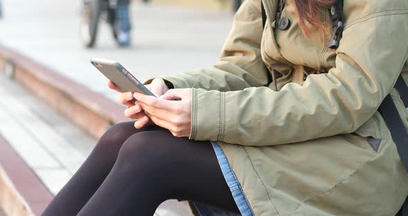 Woman use of mobile phone at outdoor