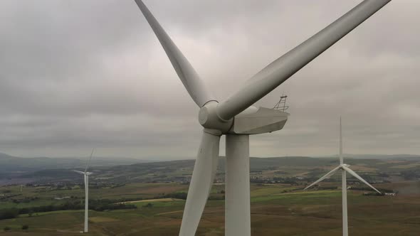 A close up of a wind turbine shot from a drone