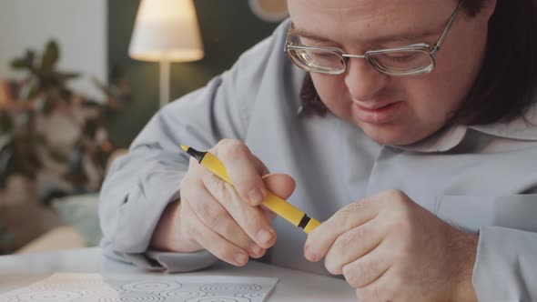 Man with Down Syndrome Drawing Picture