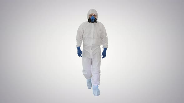 Man Wearing Hazmat Suit Walking on Gradient Background