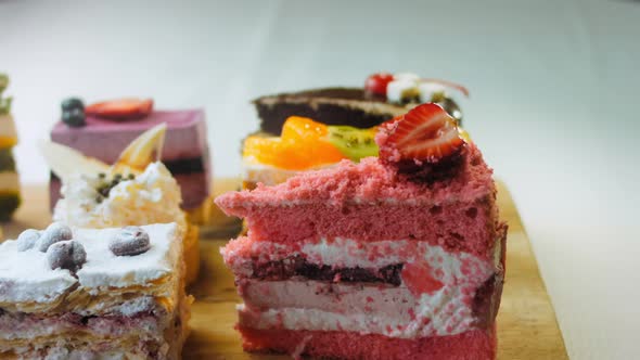 Pieces of Different Cakes on a Retrostyle Baking Tray