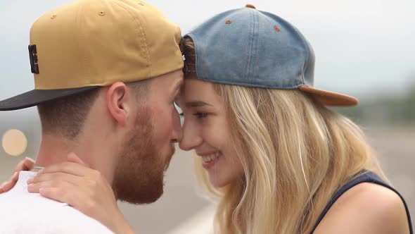 Romantic Young Couple Cycling in Small Town . Slow Motion